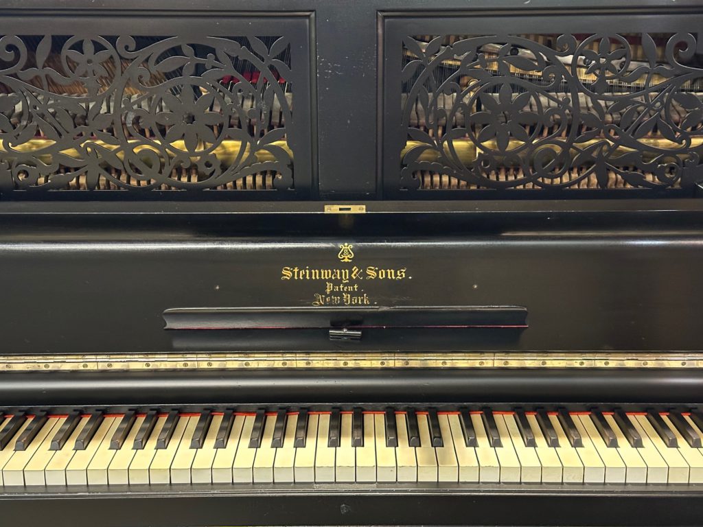 Black Antique Steinway Upright Piano